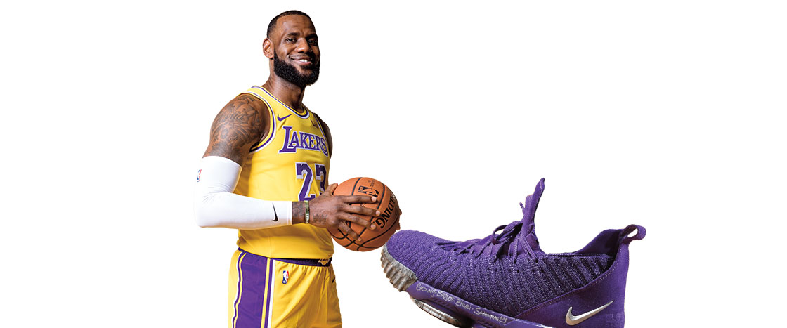 LeBron James in his Lakers uniform holding a basketball and a purple Nike sneaker