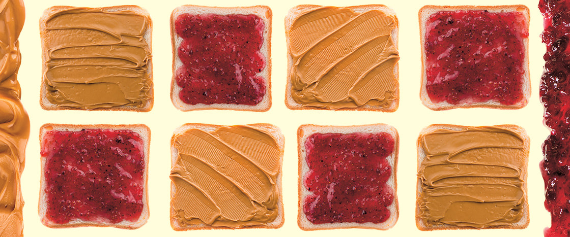 Image of slices of bread with peanut butter and jelly on them